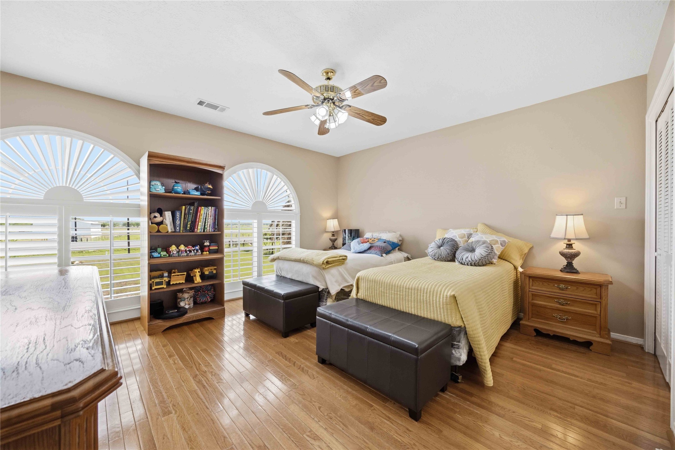 12075 Farm To Market 359 Hempstead, TX 77445 - Photo 36 of 46 a bedroom with a bed and a chandelier