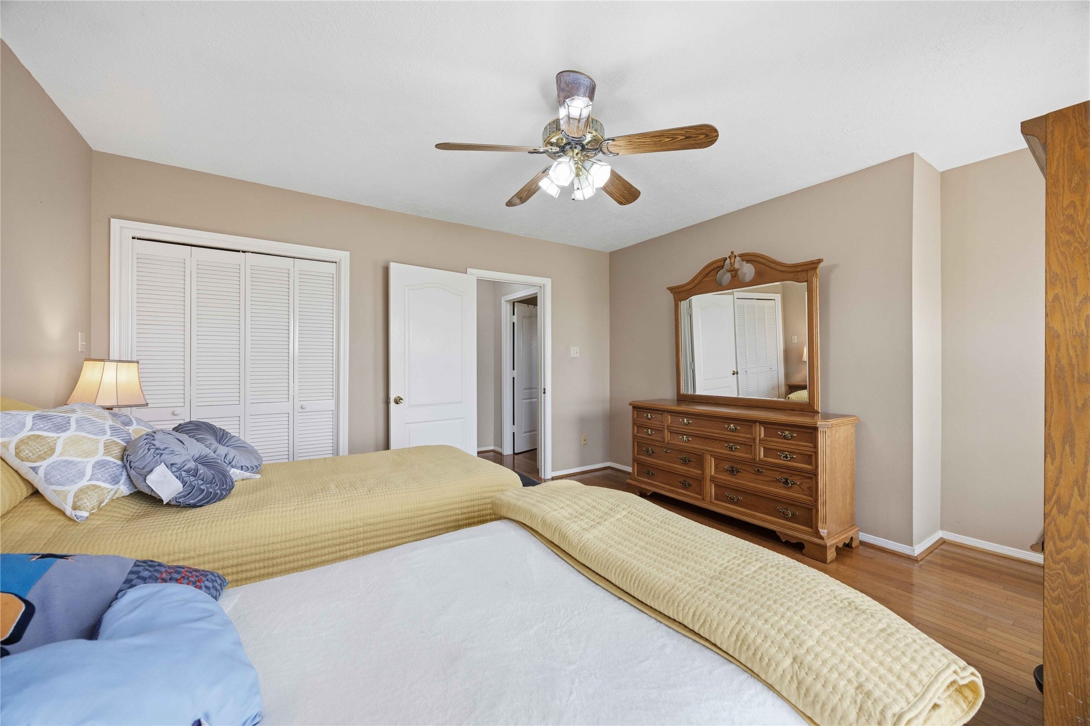 12075 Farm To Market 359 Hempstead, TX 77445 - Photo 37 of 46 a bedroom with a bed and wooden floor
