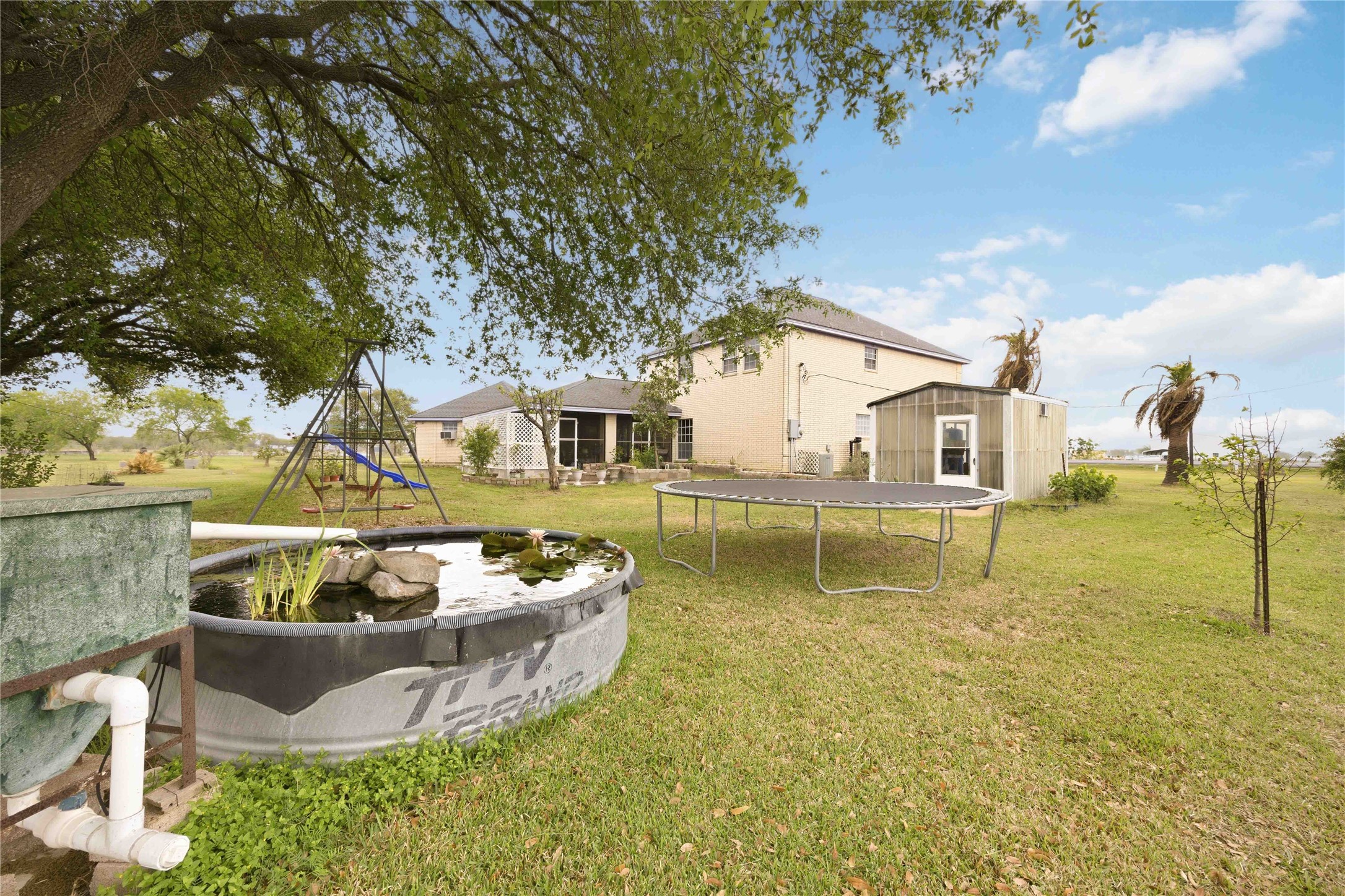 12075 Farm To Market 359 Hempstead, TX 77445 - Photo 40 of 46 a view of a swimming pool with a patio