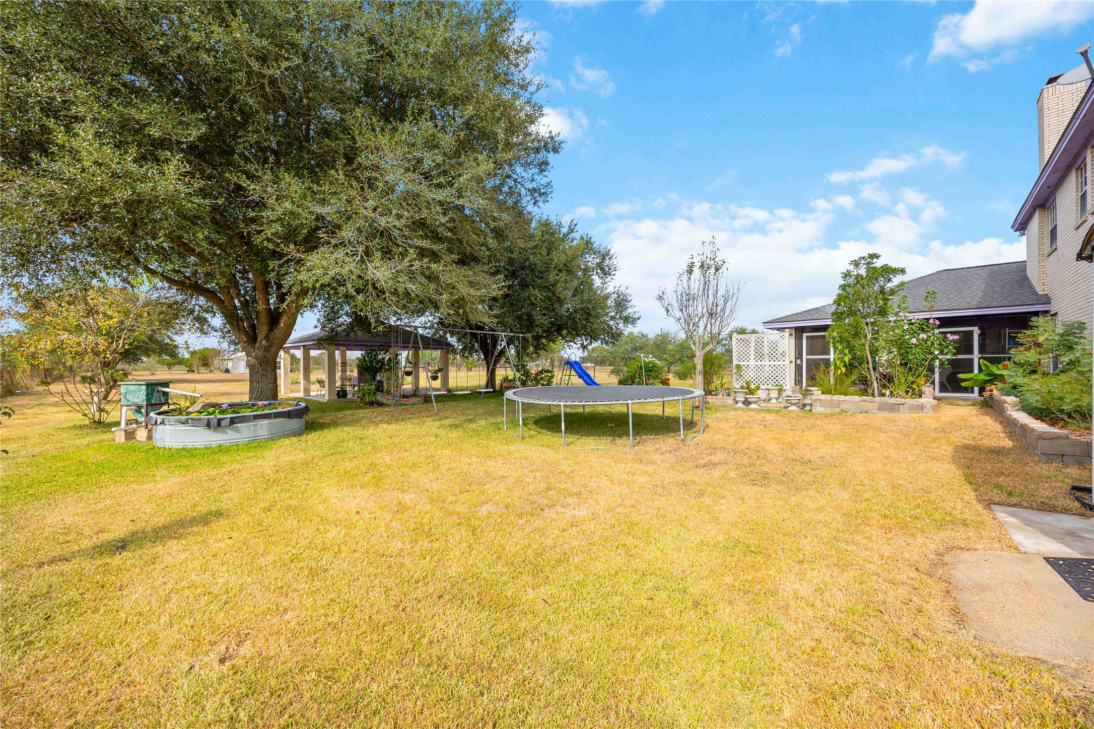 12075 Farm To Market 359 Hempstead, TX 77445 - Photo 44 of 46 a view of a swimming pool with an outdoor space and seating area