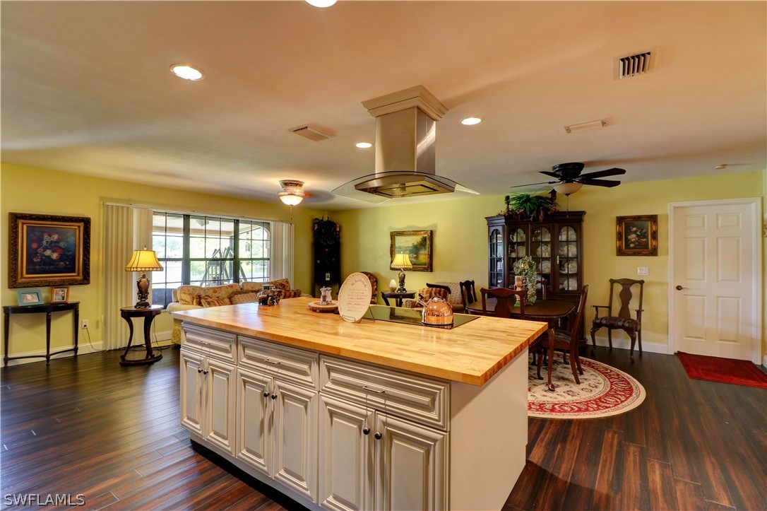 10550 Deal Road North Fort Myers, FL 33917 - Photo 14 of 35 a view of a dining room with furniture and wooden floor