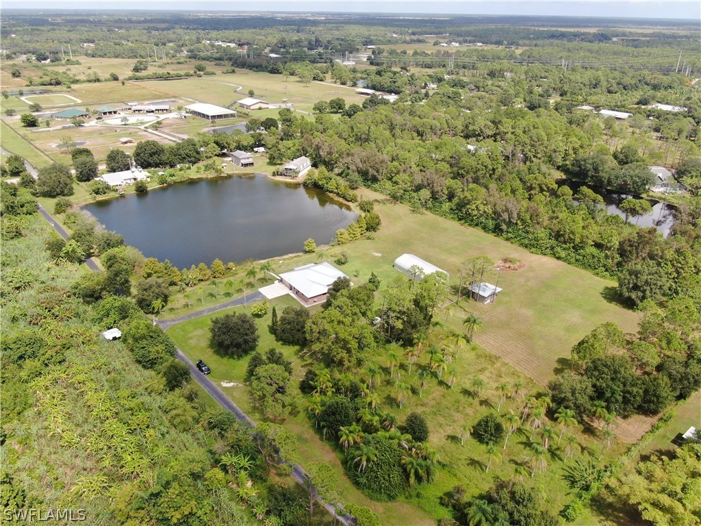 10550 Deal Road North Fort Myers, FL 33917 - Photo 2 of 35 an aerial view of residential houses with outdoor space