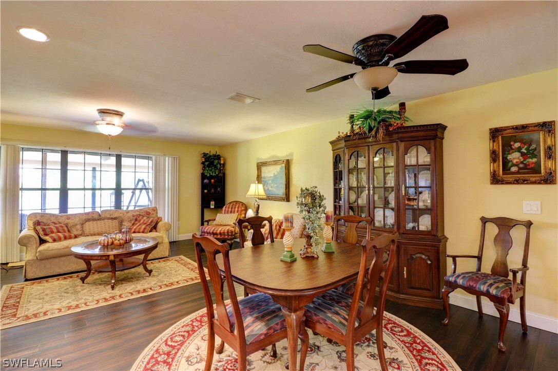 10550 Deal Road North Fort Myers, FL 33917 - Photo 22 of 35 a living room with furniture and a large window
