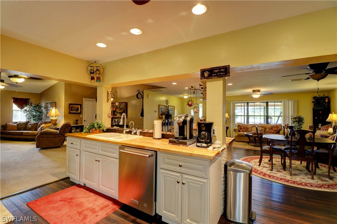 10550 Deal Road North Fort Myers, FL 33917 - Photo 23 of 35 a kitchen with a sink appliances and cabinets