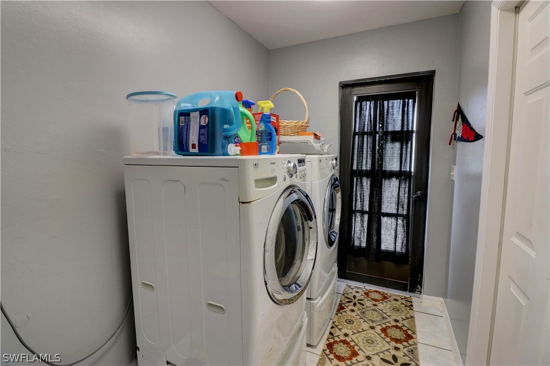 10550 Deal Road North Fort Myers, FL 33917 - Photo 35 of 35 a storage room with washer and dryer
