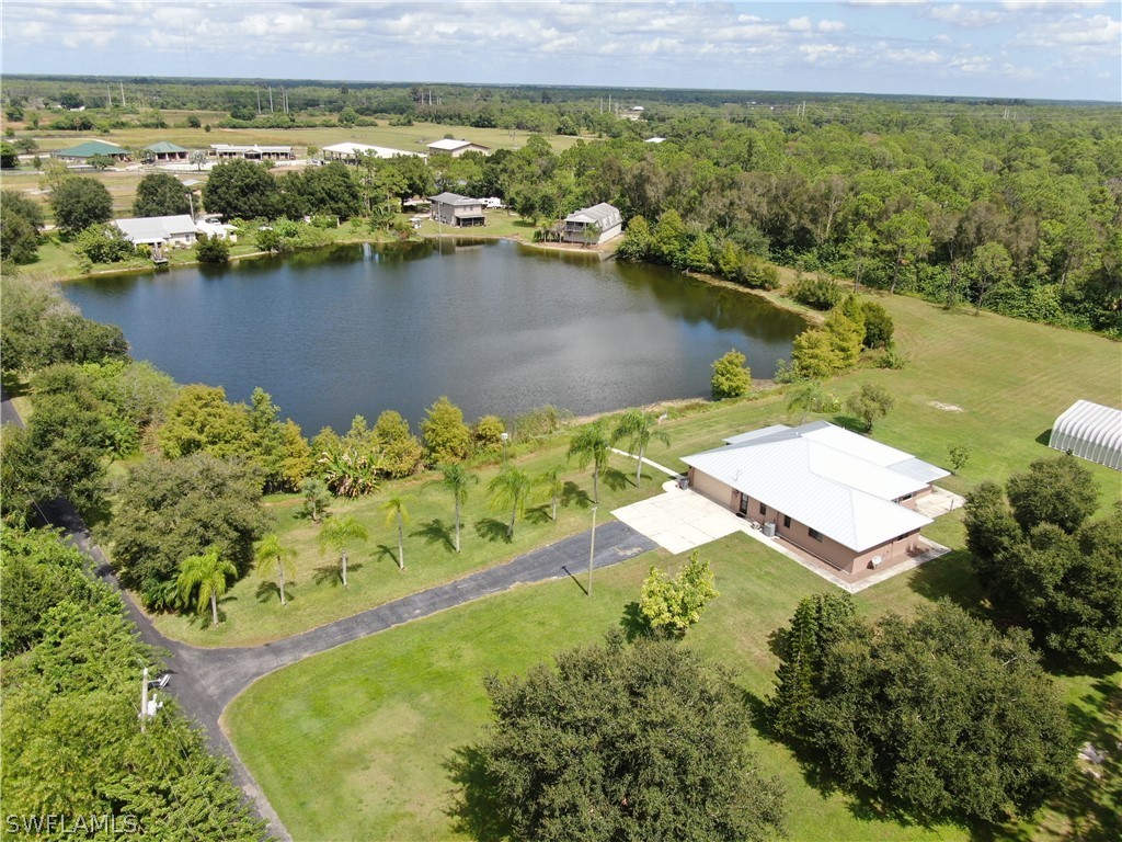 10550 Deal Road North Fort Myers, FL 33917 - Photo 5 of 35 an aerial view of residential houses with outdoor space and lake view