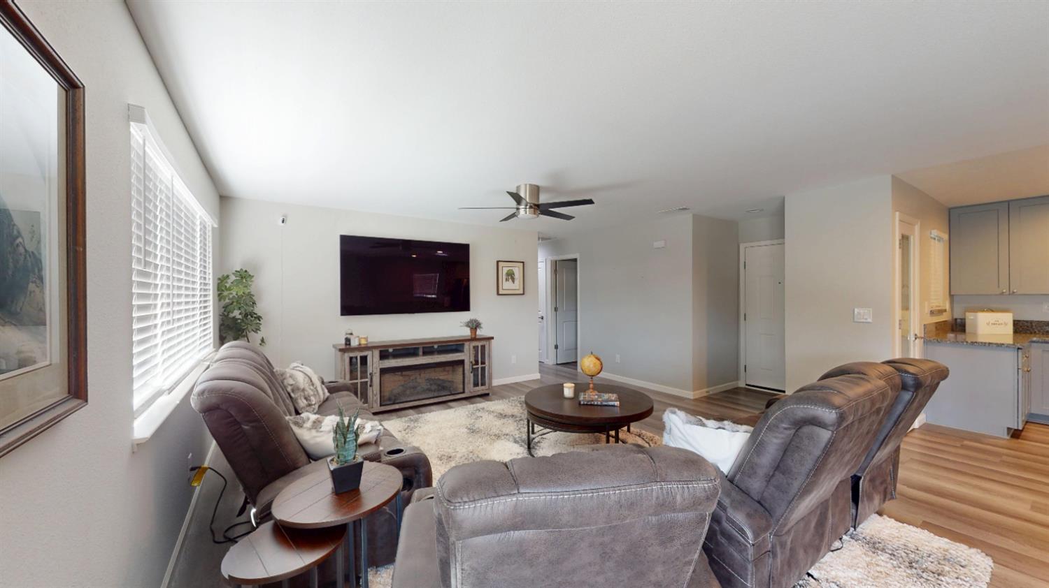 3912 Carver Road Modesto, CA 95356 - Photo 7 of 16 Light filters in through the window and also the skylight between the dining and kitchen areas. SPF flooring throughout for ease in care without sacrifice in style. Ceiling fans with remote control.