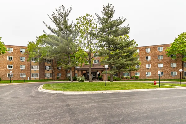 a view of a building with a yard