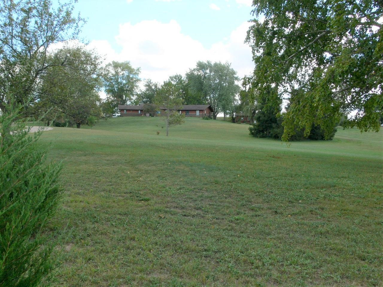 7236 Stephens Road Rockton, IL 61072 - Photo 13 of 15 a view of a field with trees in the background