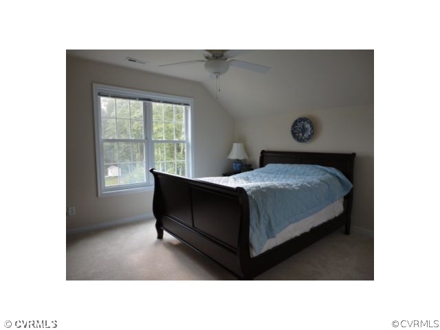 17911 Beach Road Chesterfield, VA 23838 - Photo 6 of 12 a bedroom with a bed and a table