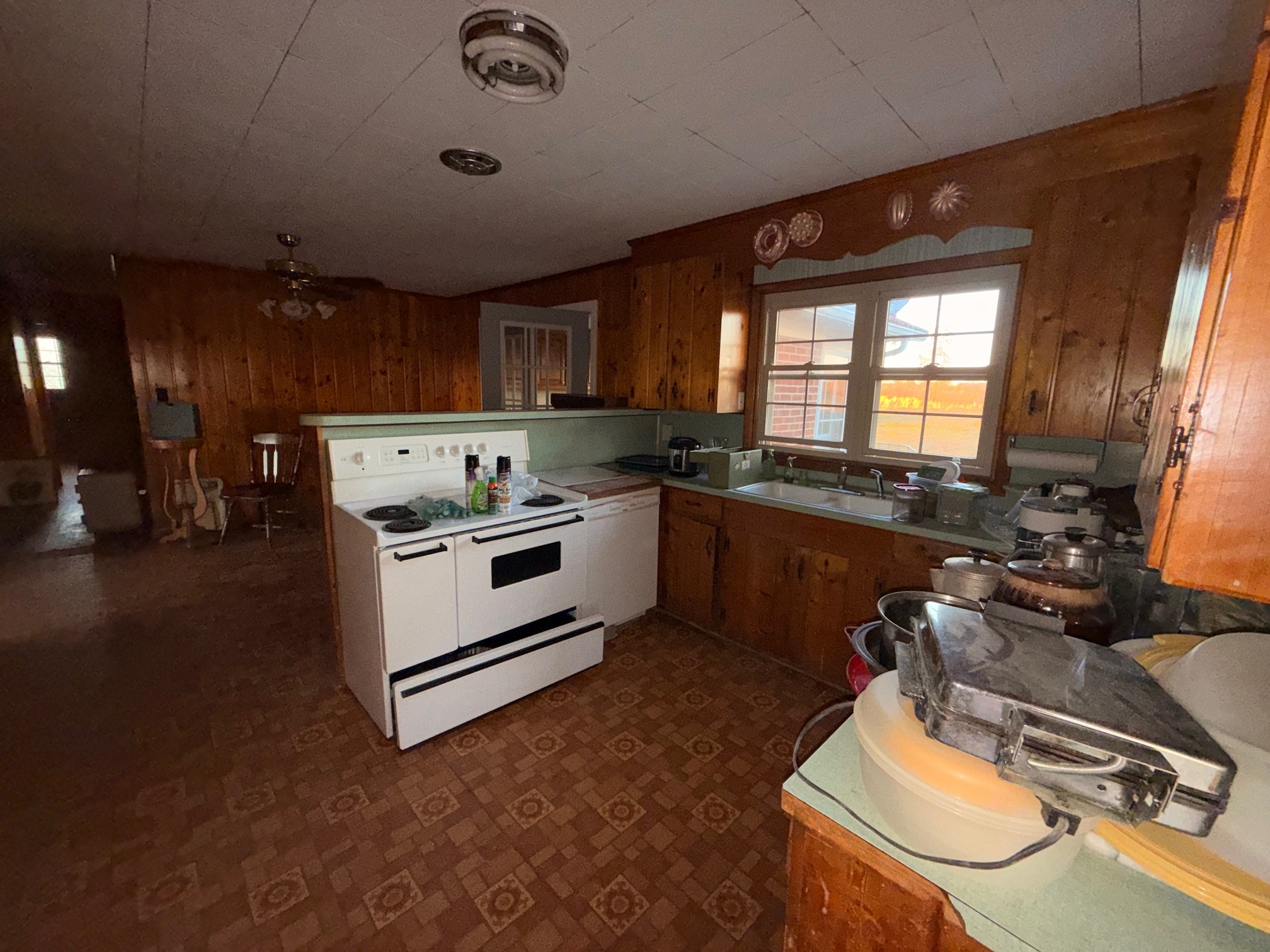 126 Dunn Road Leoma, TN 38468 - Photo 15 of 16 a kitchen with a stove a sink and a refrigerator