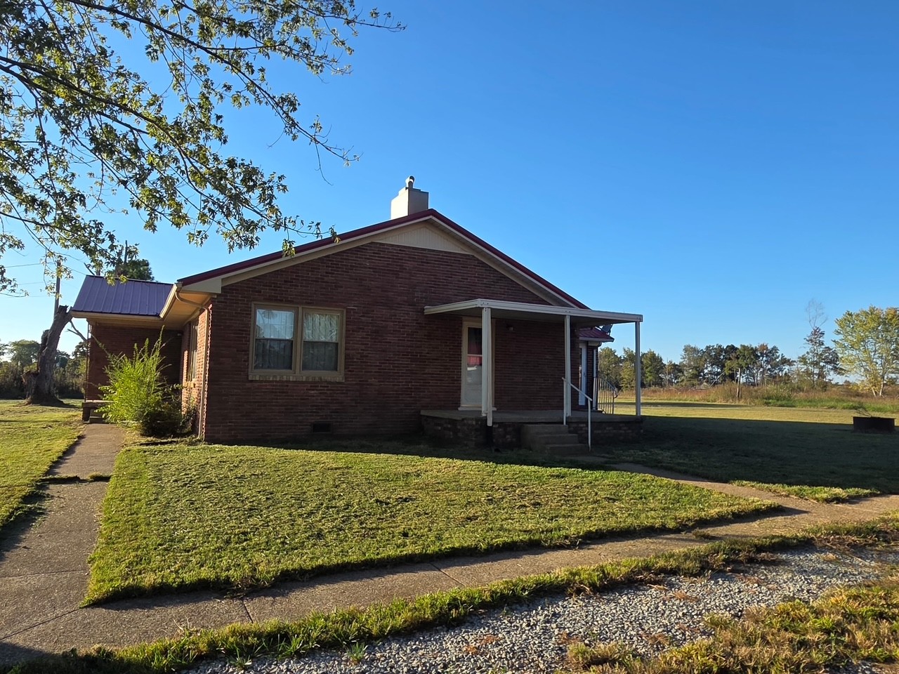 126 Dunn Road Leoma, TN 38468 - Photo 4 of 16 a front view of a house with a yard