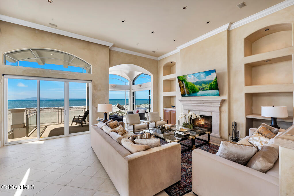 1245 Capri Way Oxnard, CA 93035 - Photo 29 of 94 a living room with fireplace furniture and a large window