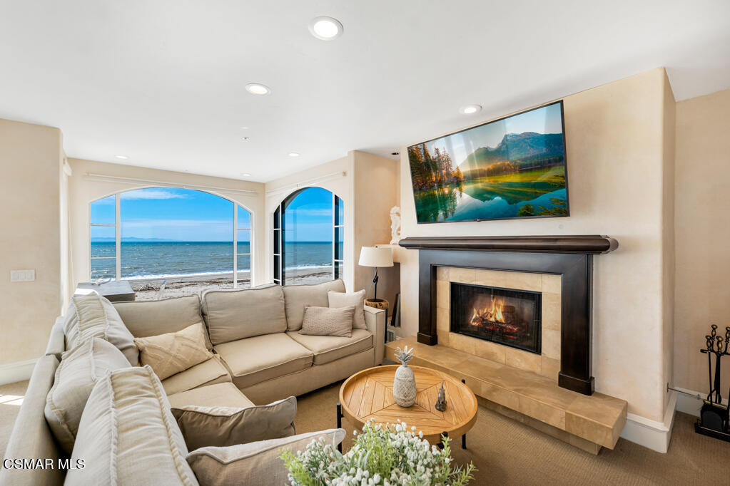 1245 Capri Way Oxnard, CA 93035 - Photo 57 of 94 a living room with furniture and a fireplace