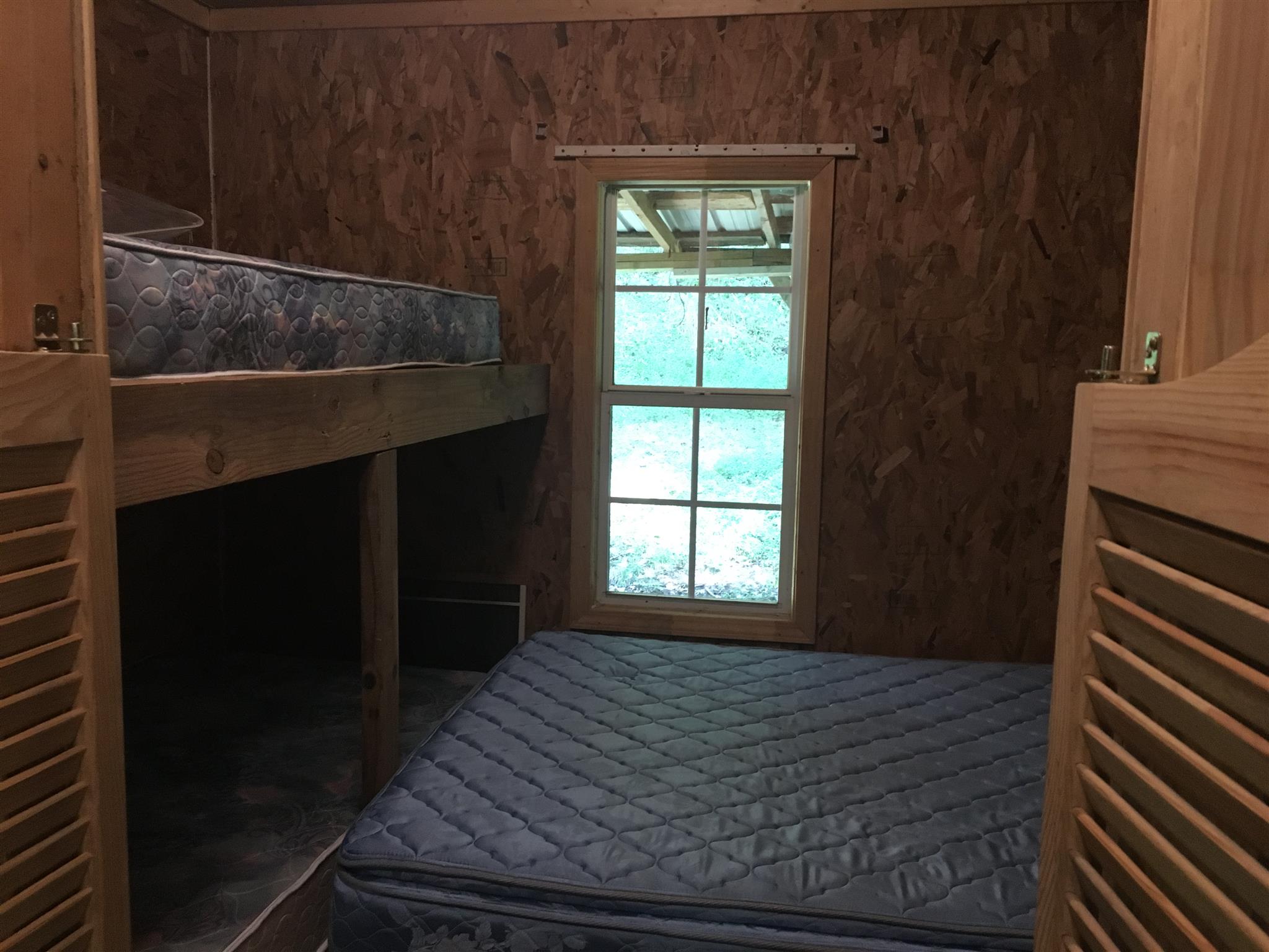 0 North Of Highway Red Boiling Springs, TN 37150 - Photo 12 of 23 a bedroom with a bed and a window