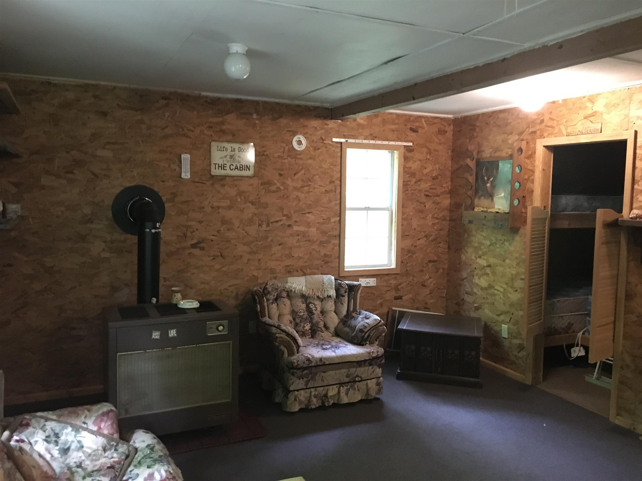 0 North Of Highway Red Boiling Springs, TN 37150 - Photo 7 of 23 a living room with furniture and a flat screen tv