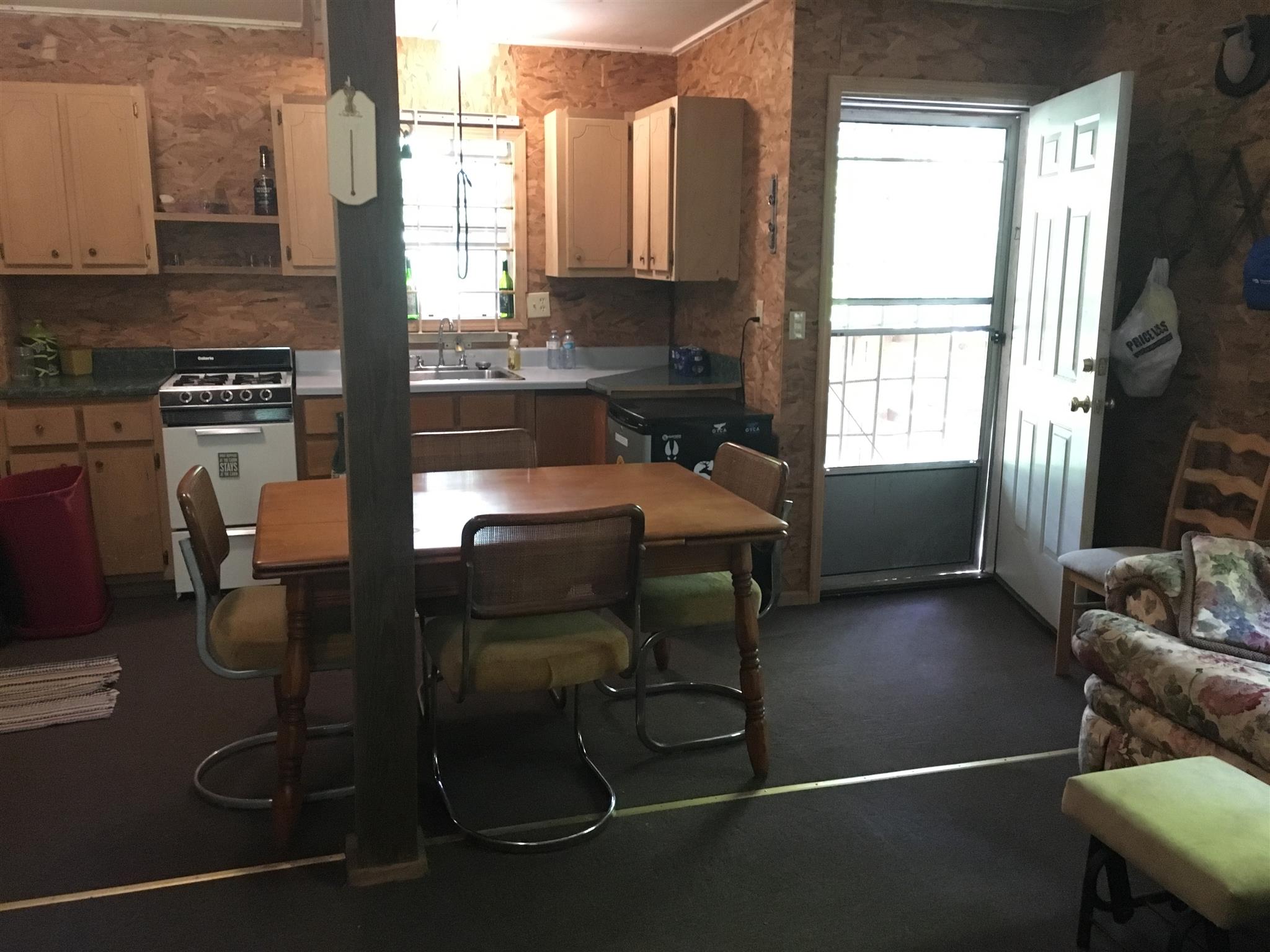 0 North Of Highway Red Boiling Springs, TN 37150 - Photo 10 of 23 a kitchen with sink a refrigerator and chairs