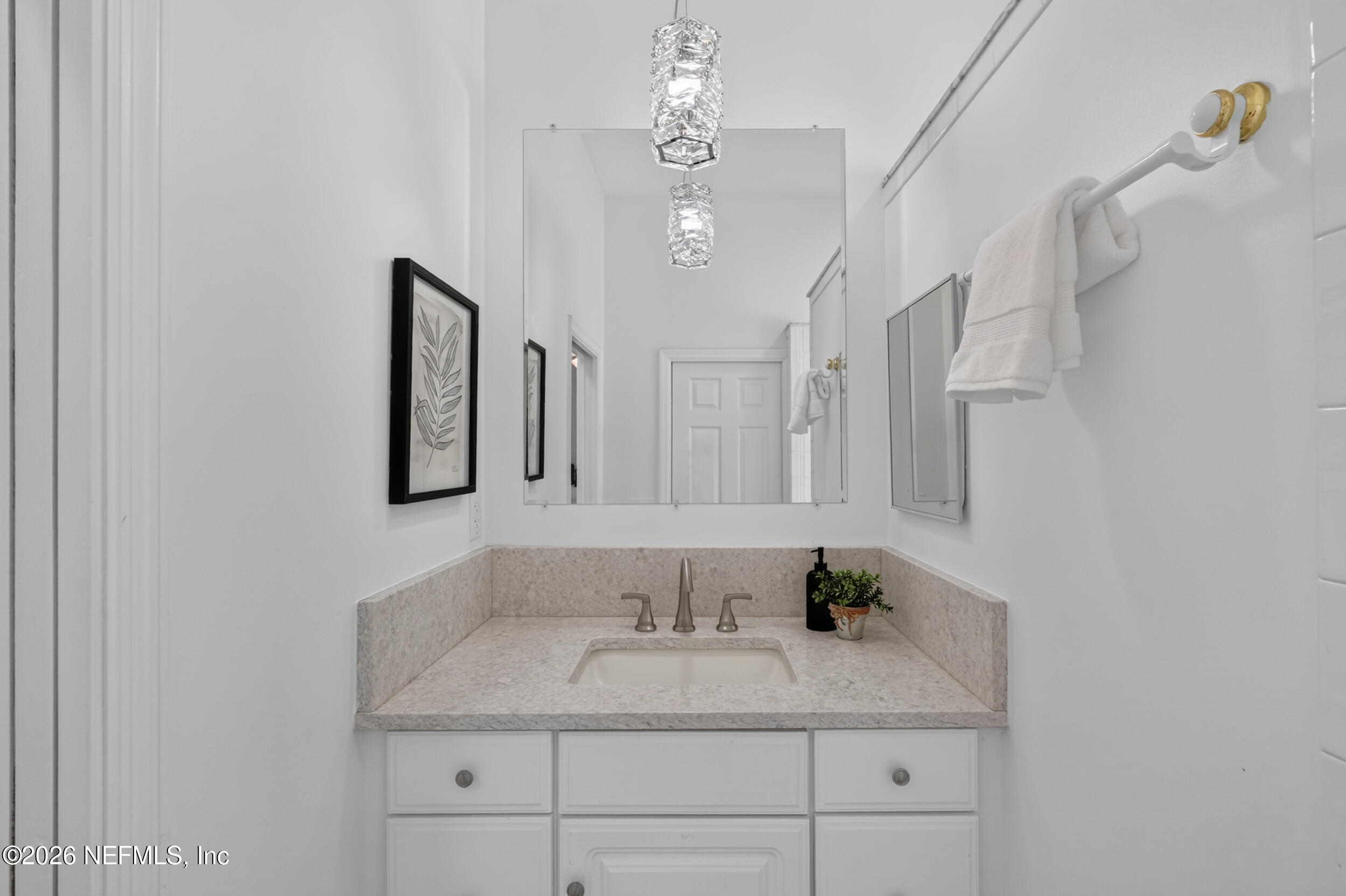 3090 Monument Bay Road St. Augustine, FL 32092 - Photo 24 of 56 a bathroom with a granite countertop sink a toilet a mirror and shower