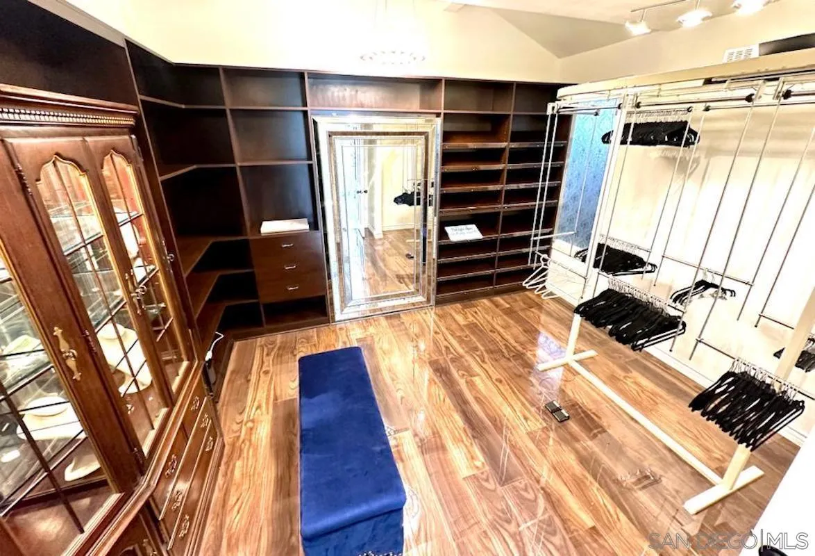 15448 Pimlico Corte Rancho Santa Fe, CA 92067 - Photo 22 of 31 a view of walk in closet with clothes and shoes