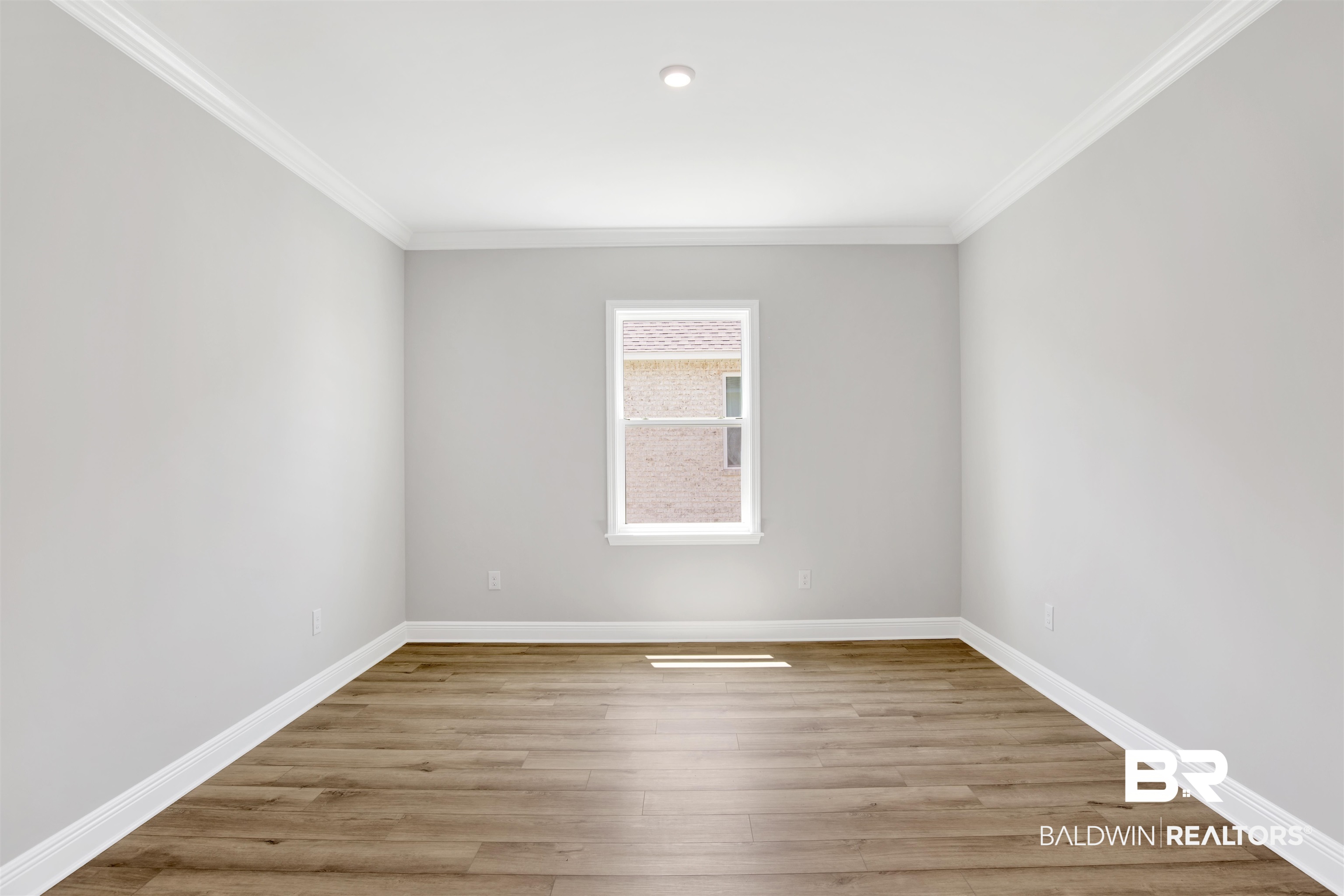 23852 Lafite Circle Daphne, AL 36526 - Photo 21 of 30 Empty room featuring light wood-style floors and ornamental molding