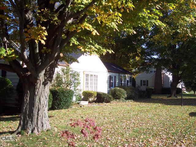 42 Ridgeview Avenue Trumbull, CT 06611 - Photo 1 of 1 a front view of a house with a yard