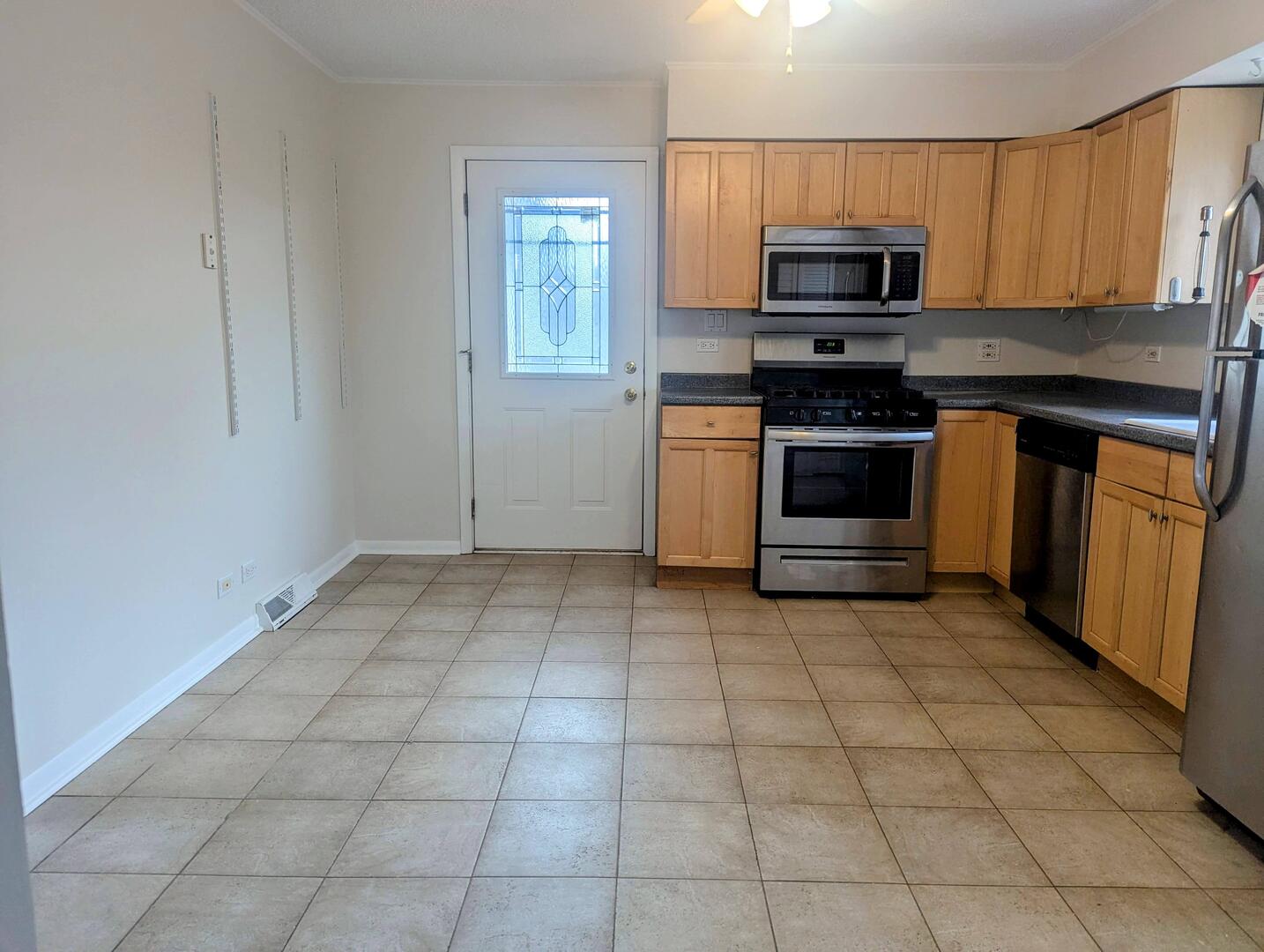 413 West Palatine Road Palatine, IL 60067 - Photo 12 of 19 a kitchen with a stove a microwave and a sink