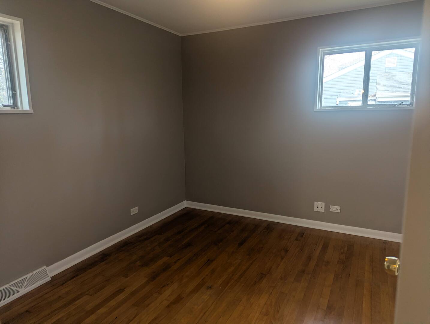 413 West Palatine Road Palatine, IL 60067 - Photo 14 of 19 a view of an empty room with wooden floor and a window