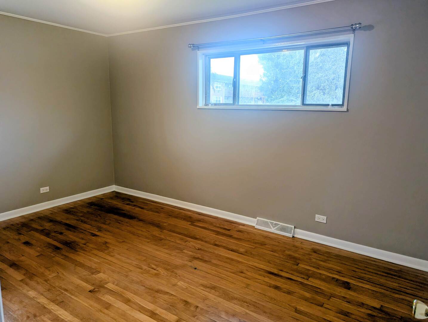 413 West Palatine Road Palatine, IL 60067 - Photo 16 of 19 a view of an empty room with wooden floor and a window