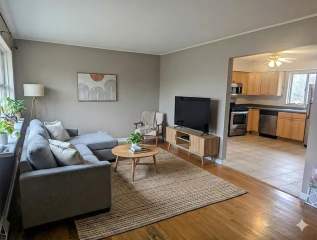 a living room with furniture and a flat screen tv