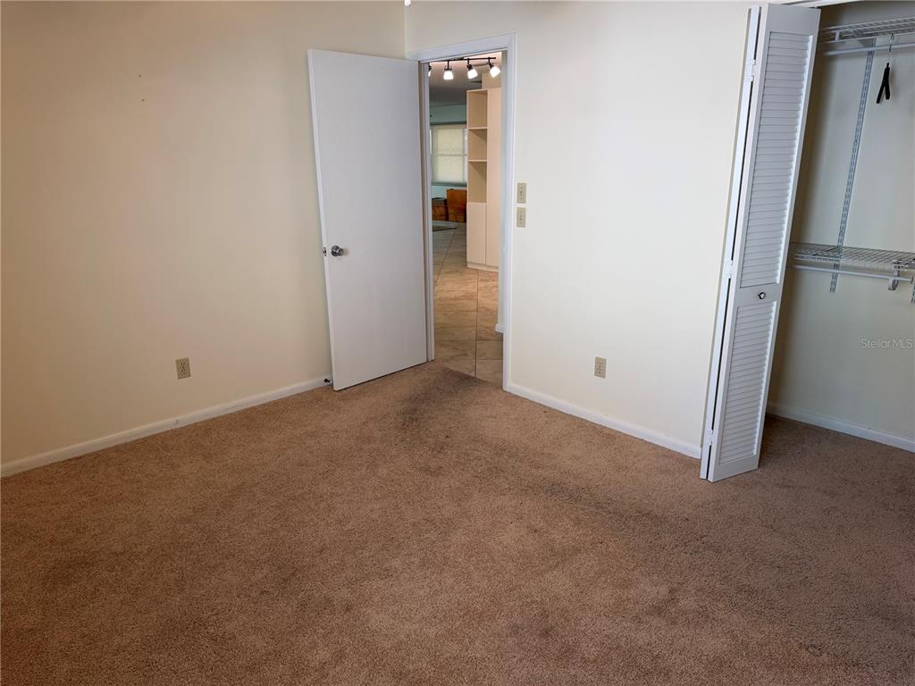 9529 Southwest 85th Avenue, Unit D Ocala, FL 34481 - Photo 15 of 21 an empty room with closet