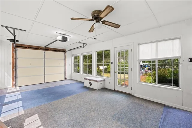 a living room with furniture and windows