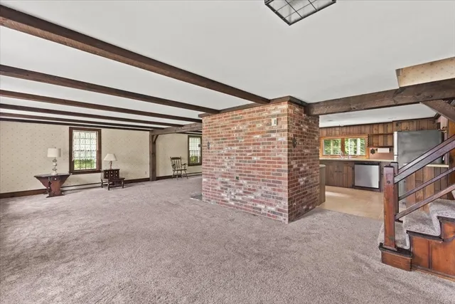 a view of an empty room with windows