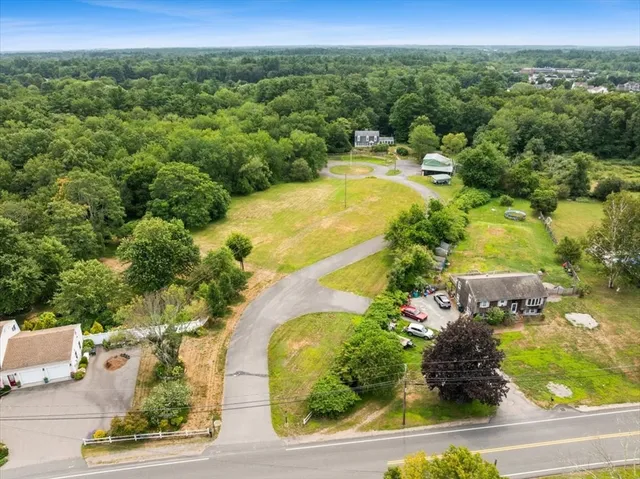 an aerial view of residential house with outdoor space and swimming pool