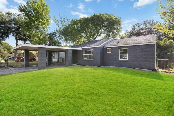 a view of a house with a back yard