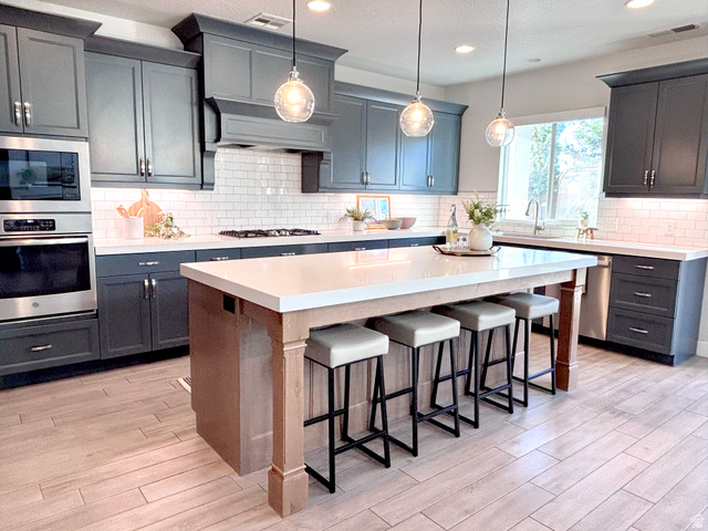 429 East Treasure Road Washington, UT 84780 - Photo 8 of 20 Modern kitchen featuring dark cabinetry, stainless steel double ovens, and a white subway tile backsplash