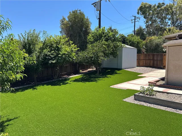 a house view with a sitting space and garden