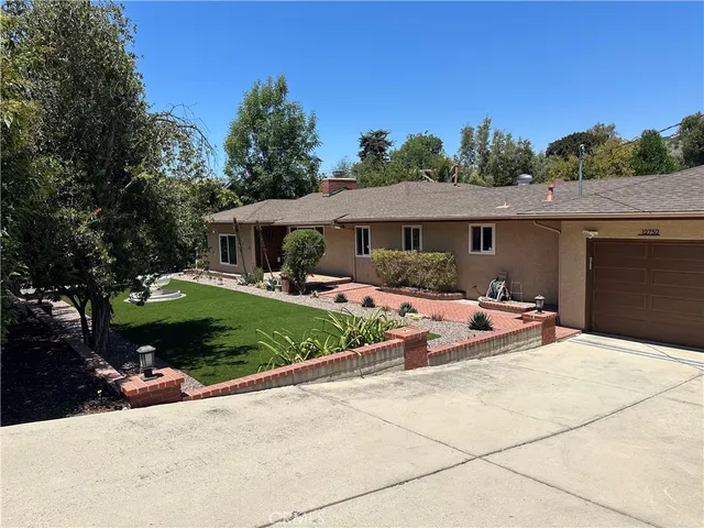 a view of house with outdoor space and porch