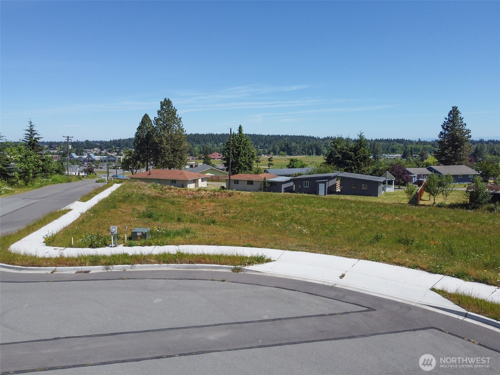 842 South Still Road Sequim, WA 98382 - Photo 1 of 13 a view of a swimming pool and trees in the background