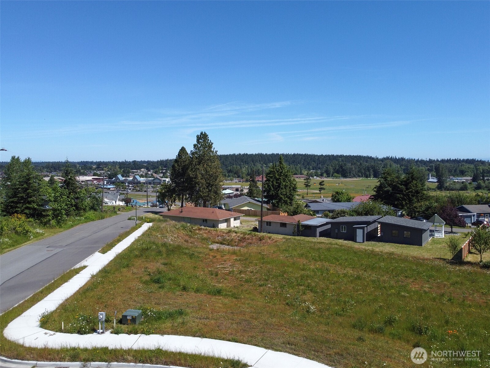 842 South Still Road Sequim, WA 98382 - Photo 13 of 13 a view of a swimming pool with lawn chairs and a big yard