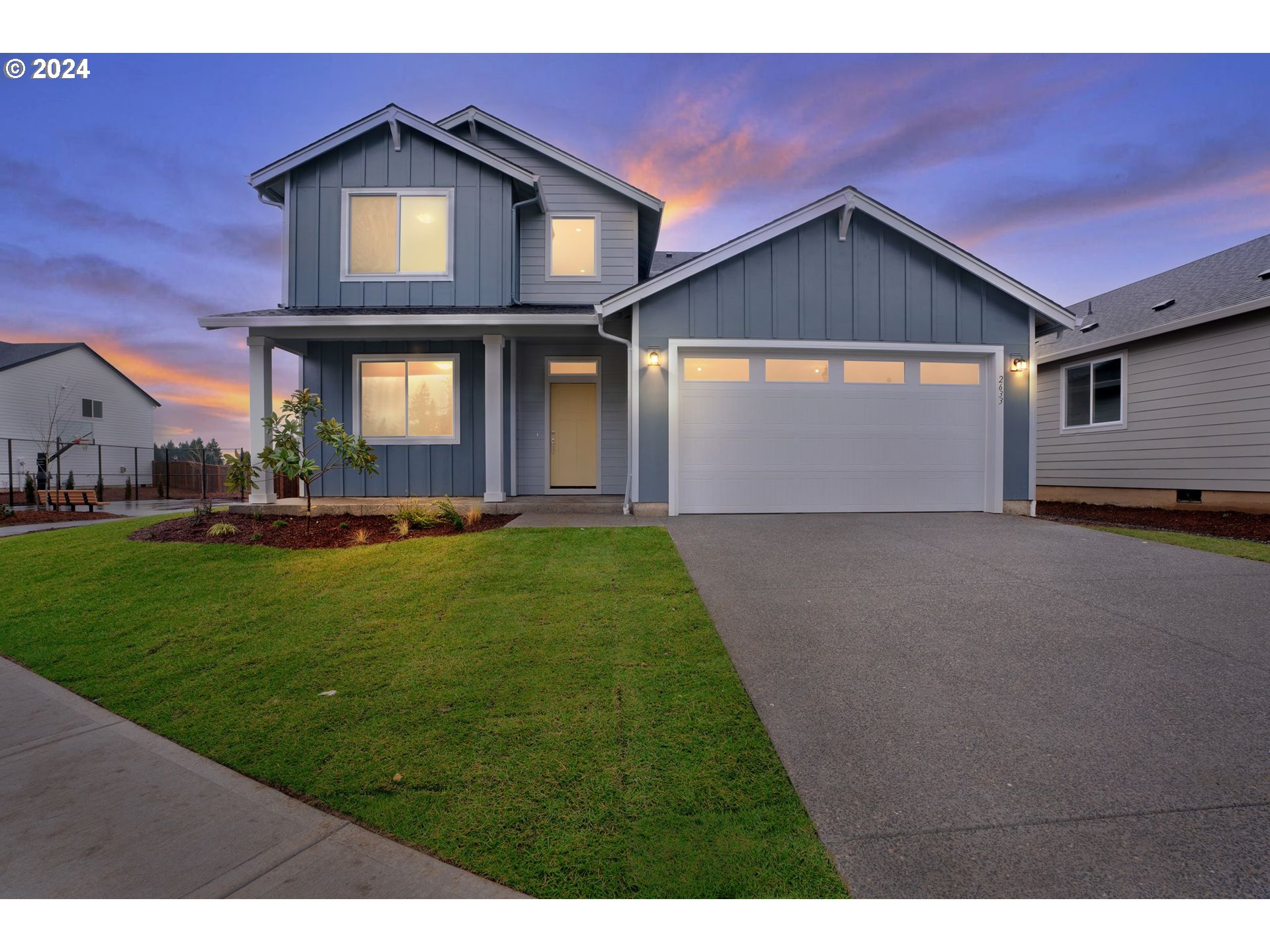 2633 South 7th Circle Ridgefield, WA 98642 - Photo 1 of 39 a front view of a house with a yard and garage