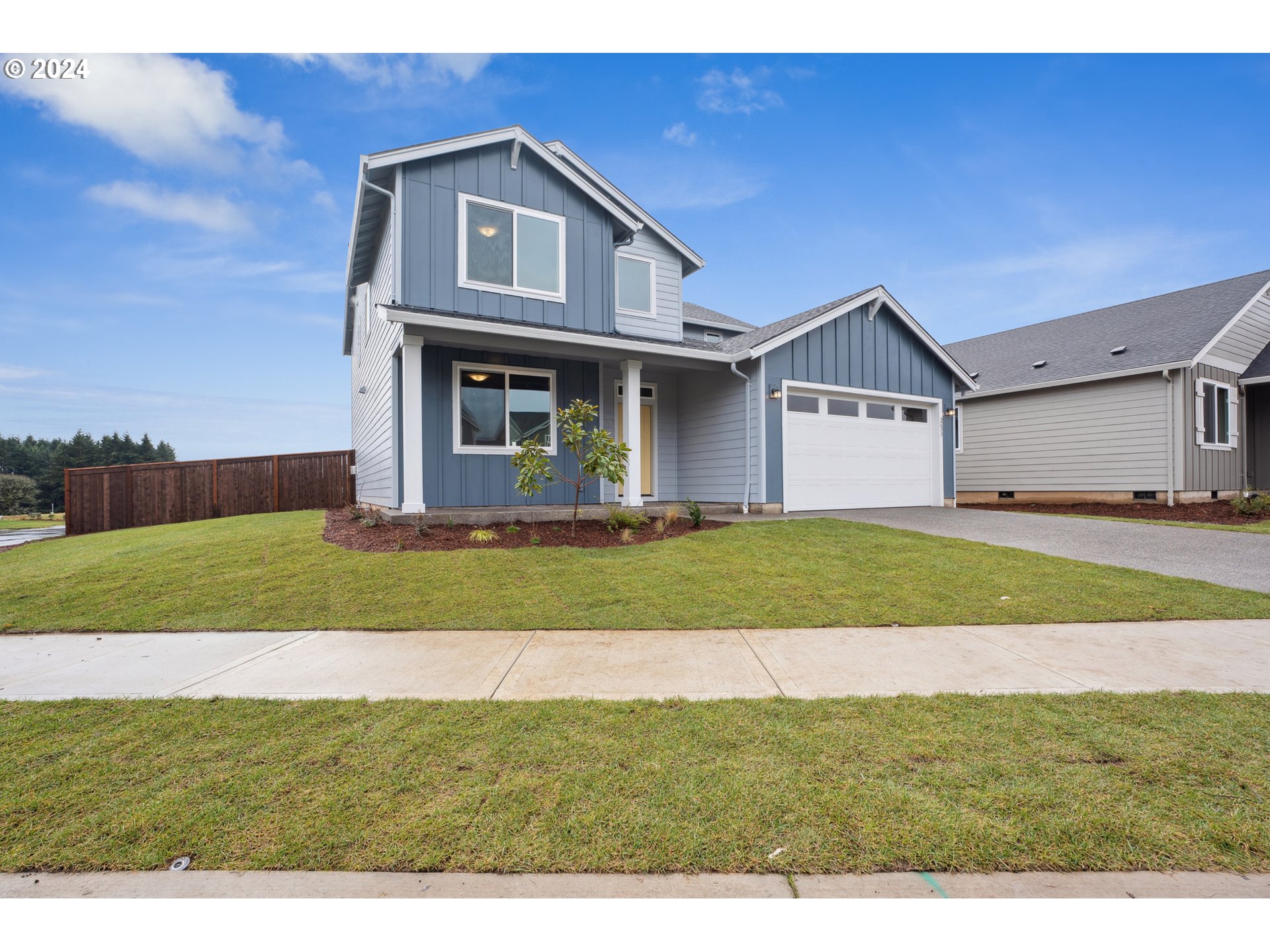 2633 South 7th Circle Ridgefield, WA 98642 - Photo 6 of 39 a front view of a house with a yard