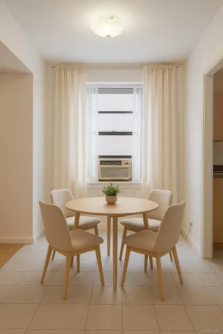 a view of a dining room with furniture and window