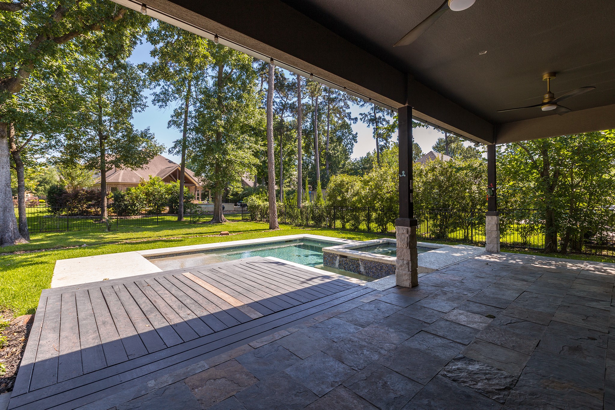 5507 Bright Timber Landing Drive Spring, TX 77386 - Photo 38 of 45 Extended deck off covered patio, perfect for sunbathing!