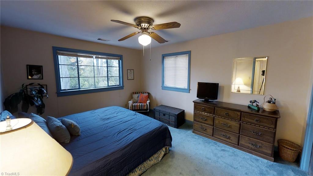1104 Rockford Road High Point, NC 27262 - Photo 21 of 30 Large 3rd Bedroom on the Upper Level. Peek out the large window that overlooks a Gardener's Dream Yard with Potty Shed, Brick Patio & walk ways, Compost and much more.