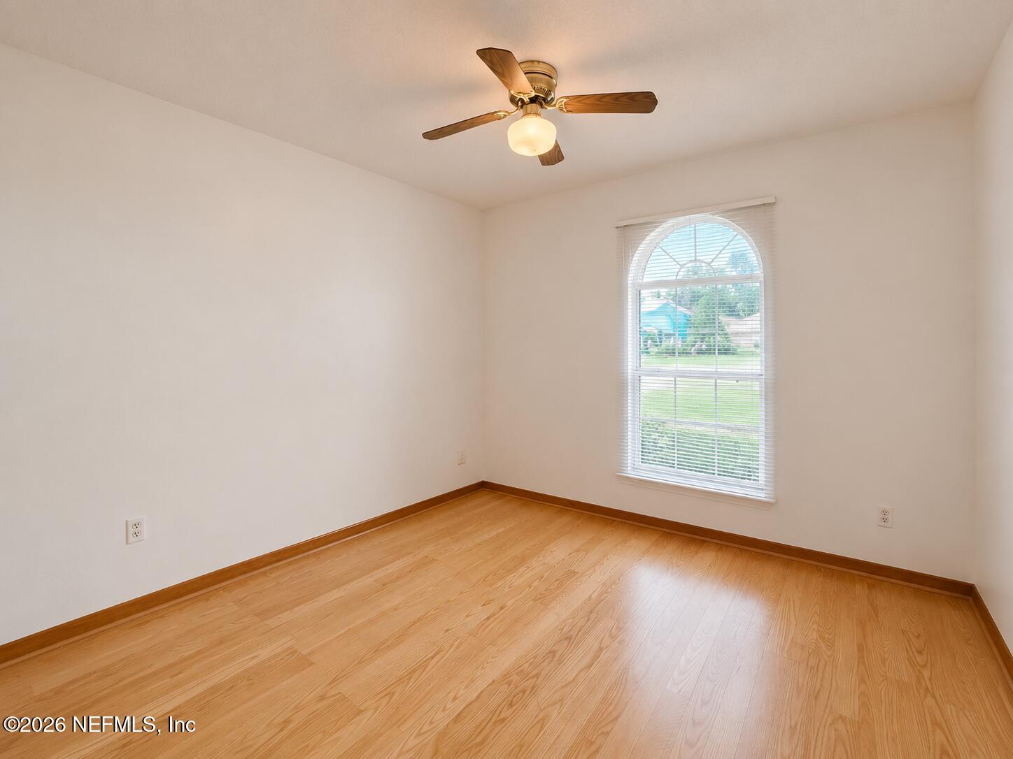6 Surfcrest Street St. Augustine Beach, FL 32080 - Photo 11 of 15 an empty room with a window and a fan