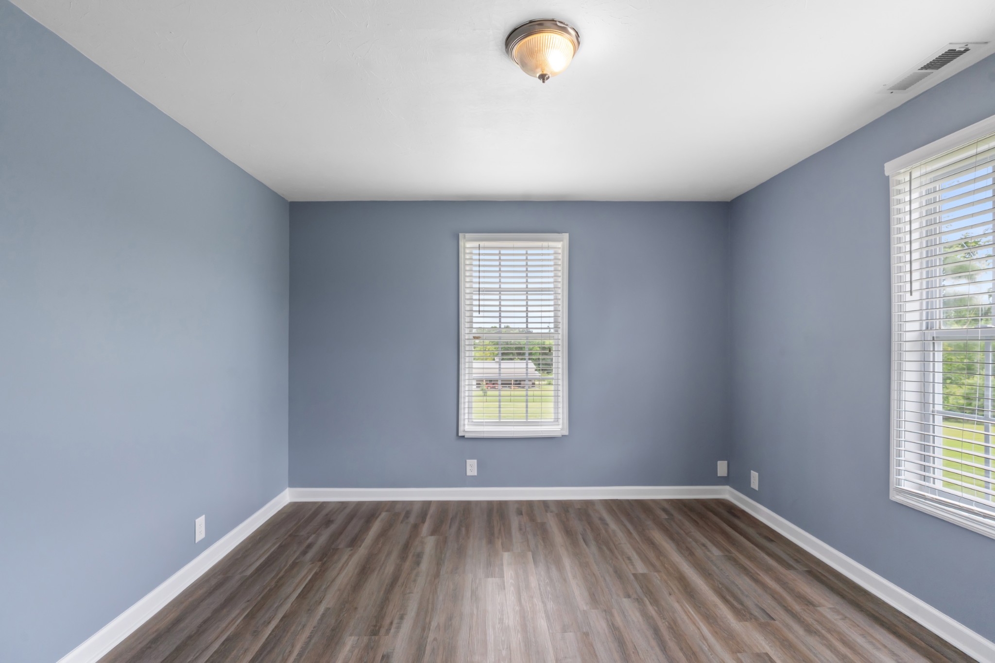 4602 Washington Road Springfield, TN 37172 - Photo 29 of 63 an empty room with wooden floor and windows
