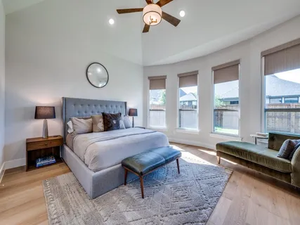 a bedroom with a large bed and a couch