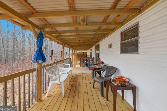 a view of a chairs and table in wooden roof