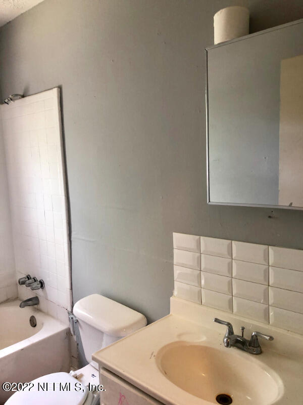 2190 Benedict Road Jacksonville, FL 32209 - Photo 5 of 5 a bathroom with a sink a toilet and bathtub