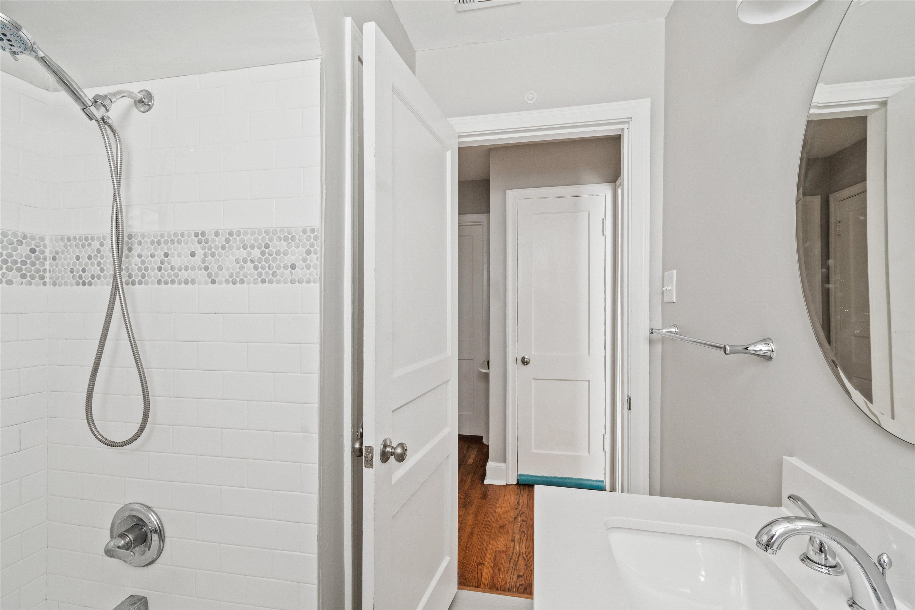 3753 Friar Tuck Road Memphis, TN 38111 - Photo 15 of 23 a bathroom with a granite countertop sink a mirror and a bathtub
